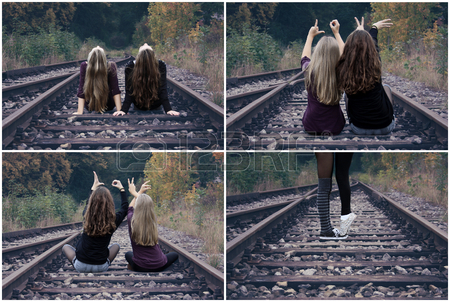 26055721-due-ragazze-che-si-siedono-sui-binari-ferroviari-e-spettacolo-amore-orizzontale